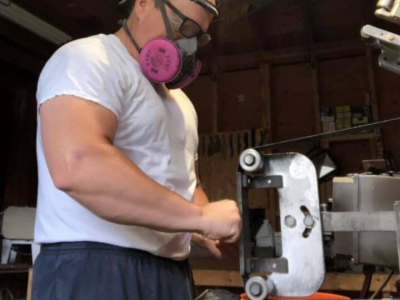 Surface grinding a knife as part of the knife making process